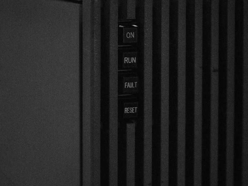 Black ribbed power-equipment cabinet with ON, RUN, FAULT and TEST buttons