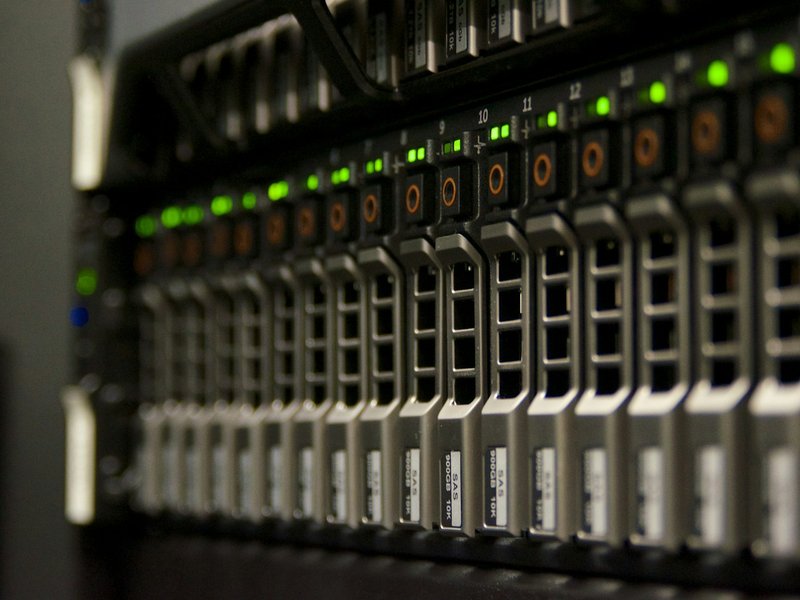 Rows of server drive bays with green status lights